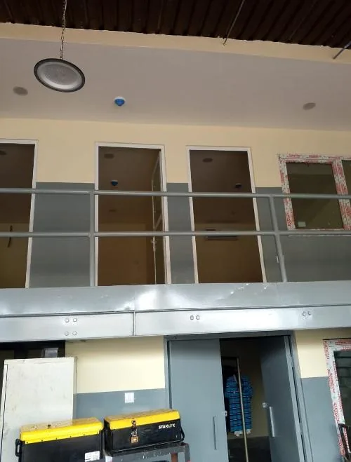 Mezzanine office revamp with metal railing and newly finished office entrances